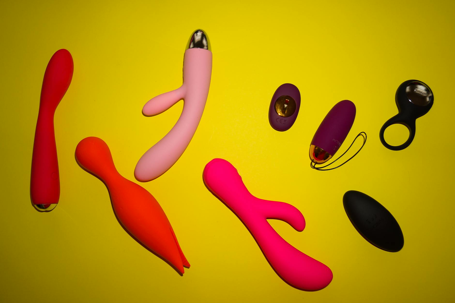 A young couple standing together indoors, exploring intimacy and connection with modern pleasure tools