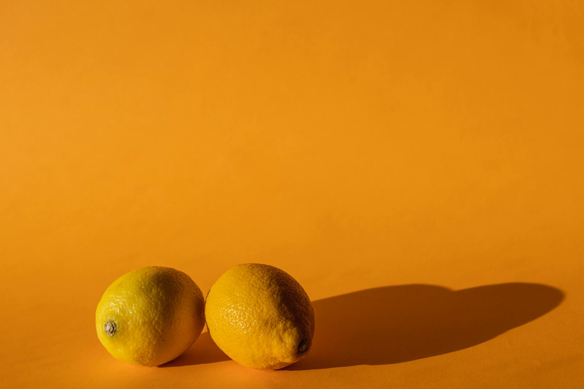 Bright yellow lemons on a vibrant background symbolizing fresh, confident self-pleasure